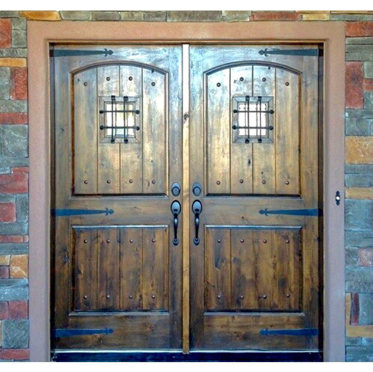 Mediterranean Knotty Alder Arch Top Speakeasy Exterior Double Door - Krosswood