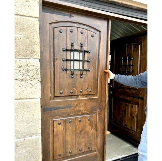 Mediterranean Knotty Alder Arch Top Speakeasy Exterior Double Door - Krosswood