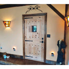 Mediterranean Knotty Alder Arch Top Speakeasy Exterior Door - Krosswood